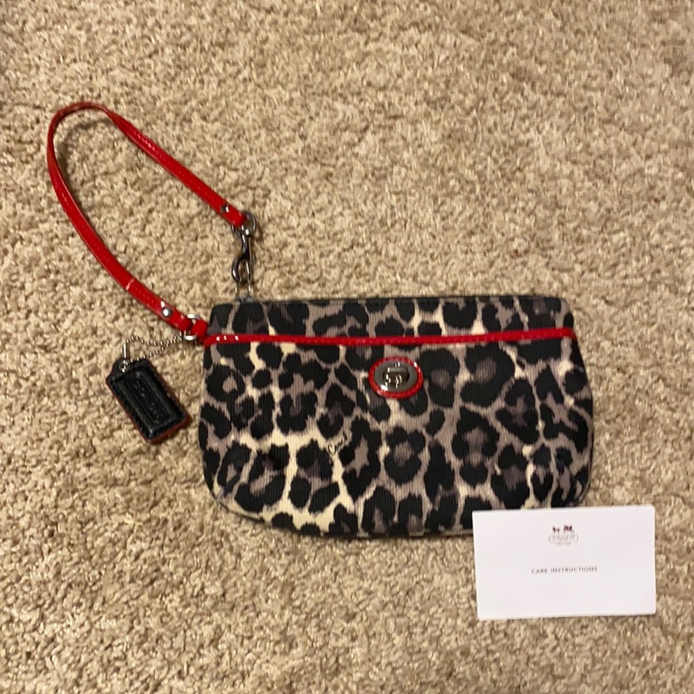Coach grey & black cheetah clutch with red trim